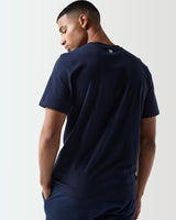 Navy core T-shirt, back view, with 11° logo near the collar