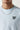 Ice blue crewneck T-shirt with small '1°' chest logo, worn with silver chain