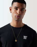 Black crew-neck T-shirt close-up with '11' logo on the chest.