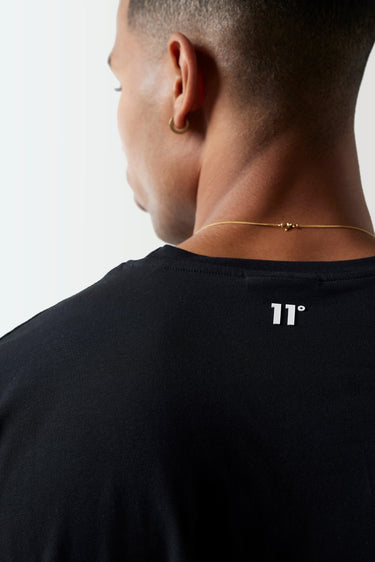 Black crew-neck T-shirt neckline detail with '11' logo at upper back.