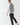 Light gray crewneck sweatshirt, side view with ribbed hem and cuffs