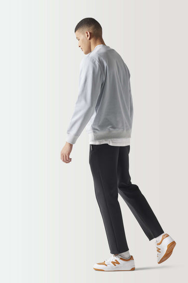 Light gray crewneck sweatshirt, side view with ribbed hem and cuffs