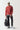 Red crewneck sweatshirt with ribbed cuffs and hem, small black chest logo