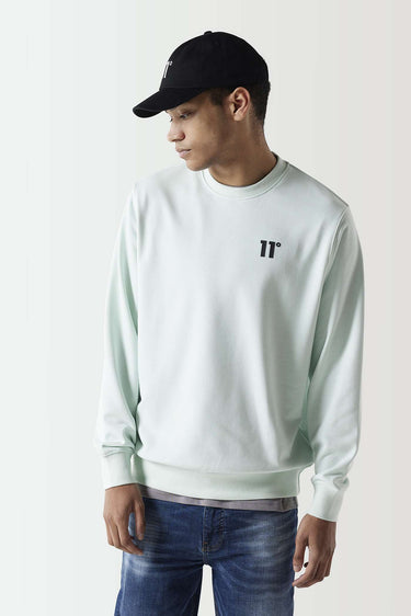 Glacier green crewneck sweatshirt with black 11° chest logo, ribbed cuffs and hem