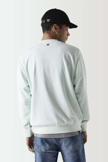 Glacier green crewneck sweatshirt with small back 11° logo, ribbed cuffs and hem