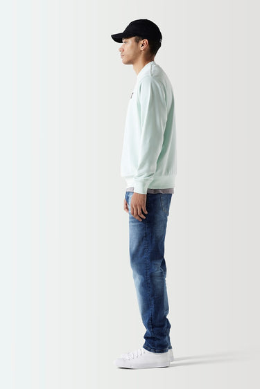 Glacier green crewneck sweatshirt side view with black 11° logo, ribbed hem