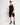 Black sleeveless vest with crew neck and 11° logo, model full view