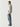Mid-blue ripped jeans with distressed thigh and knee patches