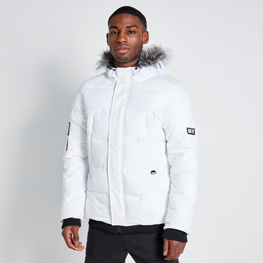 White padded winter jacket with fur-trimmed hood, front zipper, and side pockets
