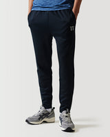 Black athletic pants with white trim accents on pockets and lower legs.