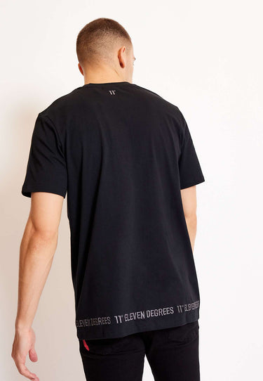 Black crew-neck t-shirt, back view, embroidered '11°' and branded hem strip