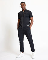 Black utility short-sleeve shirt with zip front, chest pockets, and side utility styling