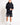 Black graphic sweat shorts with side patch logo and cuffed hem