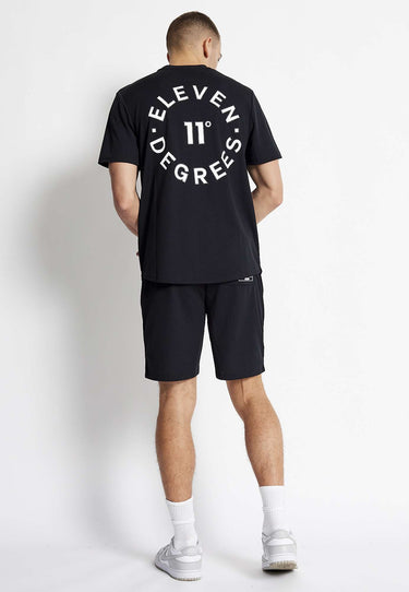 Black mesh shorts with large back print and knee-length hem