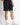 Black mesh shorts with drawstring waist and side logo detail