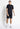 Black mesh shorts, knee-length relaxed fit with side pocket openings
