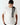 Coconut white crew-neck T-shirt with vertical black logo graphic on the front