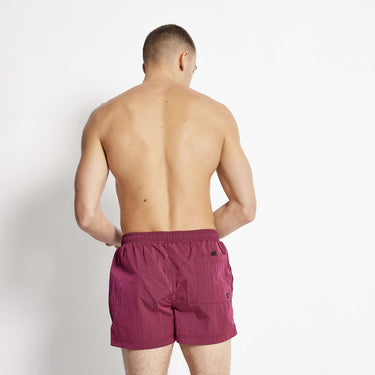 Maroon micro taped swim shorts with elastic waistband, back view.