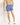 Blue swim shorts with elastic waistband and side seams; straight, above-knee length.