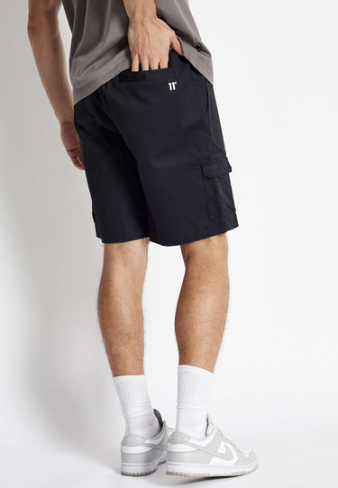 Black woven cargo shorts with flap cargo pocket and stitched side utility pocket