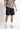 Black woven cargo shorts with side cargo pockets and straight hem