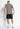 Black cargo shorts, back view, with side pockets and utility pocket details