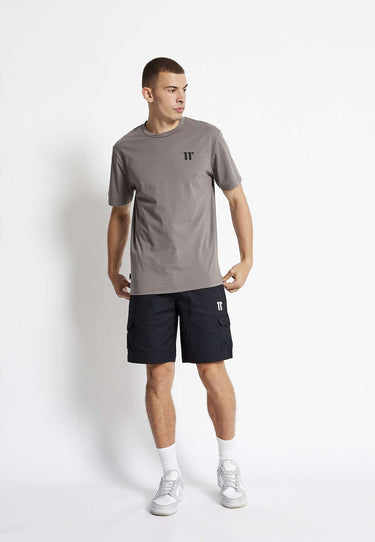 Black woven cargo shorts with belt loops, front cargo pocket, and small leg logo