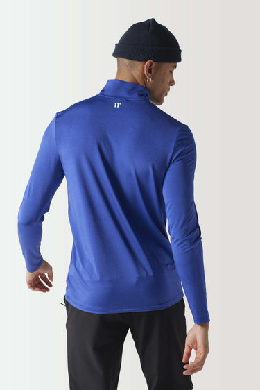 Cobalt long-sleeve quarter-zip pullover, back view with subtle space-dye texture