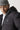 Black hooded puffer jacket close-up with small chest logo detail