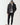 Black micro puffer jacket with hood up, front zipper, and small chest logo