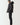 Black micro puffer jacket, side profile with hood and zip front
