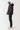 Black micro puffer jacket, side profile with hood and zip front