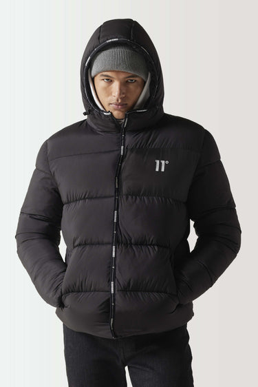 Black micro puffer jacket with hood and ribbed inner lining, zip front