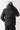 Black micro puffer jacket, back view with adjustable hood