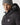 Black micro puffer jacket close-up with knit hood lining, zipper tape, and logo