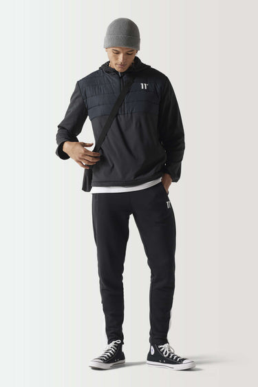 Black overhead hybrid jacket with hood, full front zipper, quilted front panels