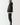 Black overhead hybrid jacket with hood, side profile, full zipper and quilted design