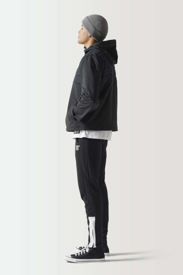Black overhead hybrid jacket with hood, side profile, full zipper and quilted design