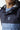 Hooded pullover jacket with 11° chest logo; navy top and light blue bottom