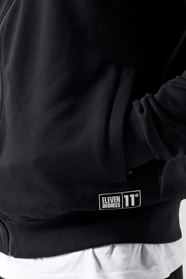 Black full-zip sweat top with Eleven Degrees logo label and white hem stripe