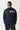 Navy full-zip sweat top with light blue stripe across the chest