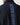 Navy full-zip sweat top close-up of vertical back logo text