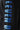 Black hoodie close-up of tall blue gradient logo-style print.