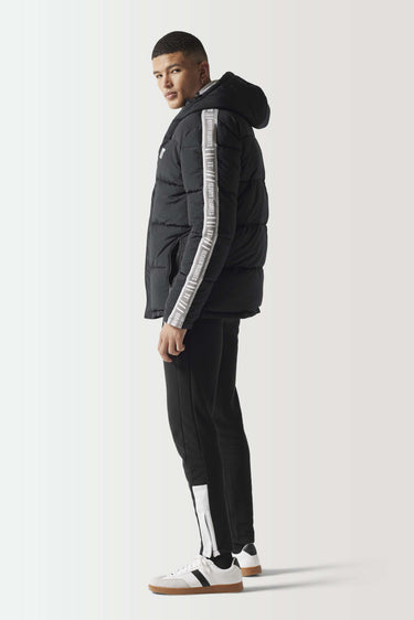Black puffer jacket with taped sleeve stripe and hood