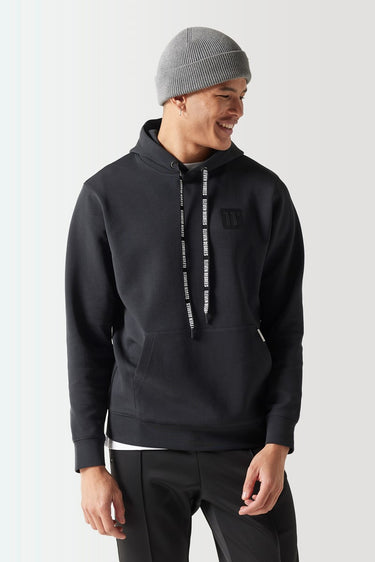 Black pullover hoodie with drawstring hood and small chest logo, front close-up