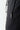 Black track pants pocket detail with vertical zip and small logo tab