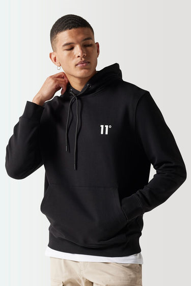 Black hoodie with drawstring hood and '11°' emblem at center chest