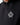 Black hoodie close-up of drawstring hood and front crest emblem