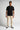 Cool sand chino trousers with straight legs, front pockets, and belt loops
