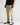 Cool sand chino trousers in side view with straight leg shape and stitched seams